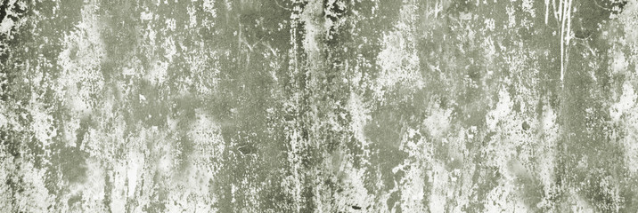 Concrete wall. Weathered old paints on the spilled wall.