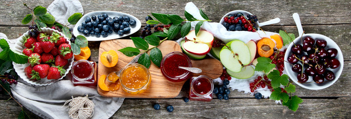 Assortment of jams and seasonal berries, fruits