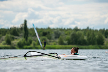 Woman participating in a windsurfing course