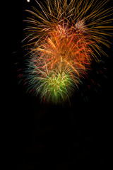 Fototapeta premium Close-up of colorful fireworks in black background