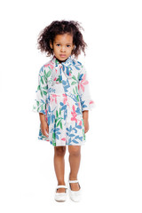 Portrait of pretty little african american girl in white floral dress on white background