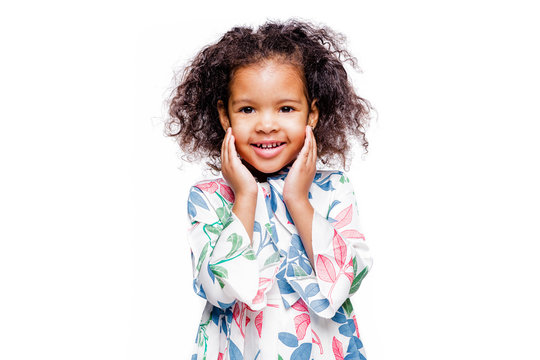 Little Pretty Fashionable African American Girl In Blue Dress With Surprised Facial Expression On White Background