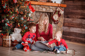 little boys reading with his mother