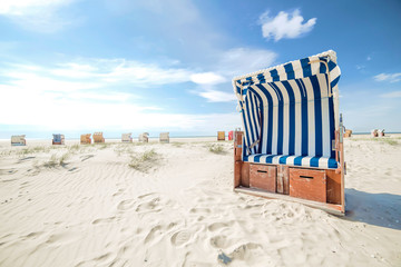 Blue and white striped beach chair or bench