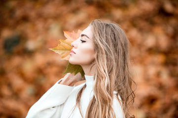 Outdoor atmospheric lifestyle photo of young beautiful woman.