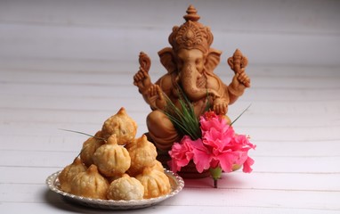 Ganesh Puja - Sweet Modak food offered on Ganpati festival or Chaturthi in India. in silver plate