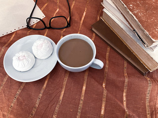 white cup of coffee and sweet marshmallows