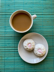 white coffee cup on turquoise