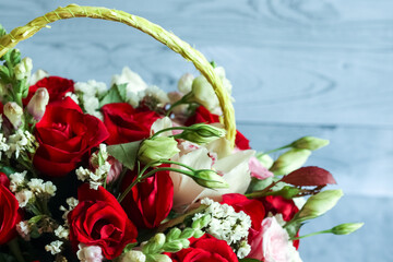 Bouquet of red roses, eustoma, orchid. Still life with colorful flowers. Fresh roses. Place for text. Flower concept. Fresh spring bouquet. Summer Background