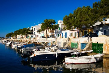 Fototapeta na wymiar Boats in the port of Porto Colom on the island of Mallorca in the Mediterranean Sea in Spain.