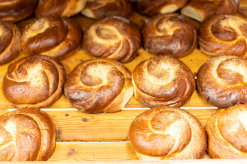 Fresh buns on wooden background