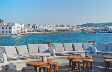 The comfortable terrace with a view to the old port of Chora of Mykonos island in Greece