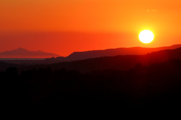 Fototapeta na wymiar Sunset on the Tuscan Maremma.