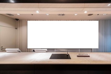 Fototapeta premium Blank advertising signs placed behind the reception counter at the office building