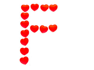 The letter F is made up of small red hearts isolated on a white background. Bright red font.