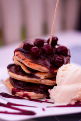 Pancakes with chocolate, cherry and vanilla ice cream