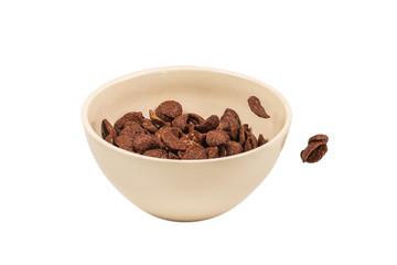 Chocolate corn flakes falling to the white bowl isolated on white. Motion.