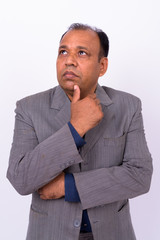 Portrait of mature overweight Indian businessman in suit