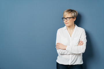 Woman with crossed hands looking aside