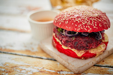 Beetroot burger on shabby table