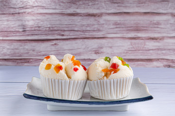 Thai steamed cupcakes topped with dry fruit on plate