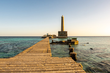 Sanganeb Reef Lighthouse near Port Sudan, on the Red Sea, in Sanganeb National Park, wooden pier...