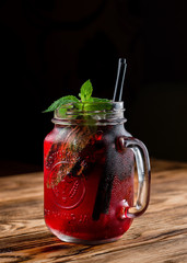 red lemonade in a mug on the table