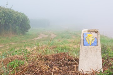 the dirt road marked with the sign of the road to santiago