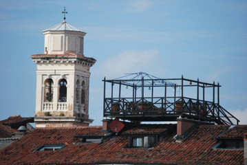 typical Venetian terrace called Altana, built over the roofs, with the bell tower in the background