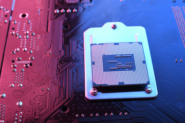 Computer cpu processor chip on circuit board ,motherboard background. Close-up. With red-blue...