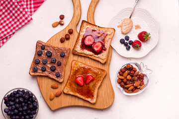 making breakfast peanut butter and jelly sandwich