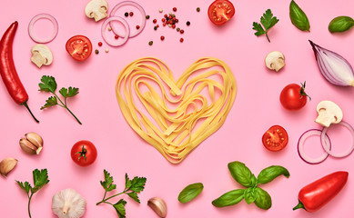 Tomato, basil, spices, champignons, garlic, pasta. Vegan food, creative composition on pink. Fresh basil, tomatoes layout, macaroni heart. Cooking. Italian pasta love concept, top view.