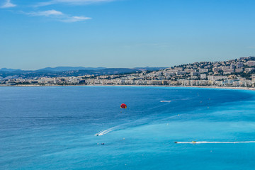Obraz premium Wonderful panoramic view of Nice with colorful historical houses, seacoast and sea from Cimiez hill. Nice - luxury resort of Cote d'Azur, France.