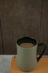 cup of coffee on wooden table