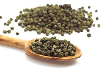 Green Peppercorn, piper nignum, Green Berries against White Background