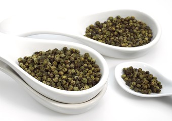 Green Peppercorn, piper nignum, Green Berries against White Background