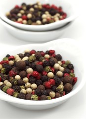 Five Peppercorns, piper nigrum, Black, Green, White, Pink and Jamaica Pepper, Berries against White Background