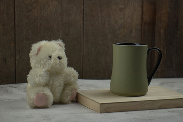 teddy bear with a cup of coffee