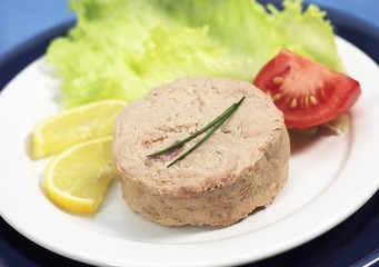 Can of Tuna Fish, Tuna in a Plate with Salad, Tomatoes and Lemon