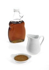 Bottle of Maple Syrup against White Background