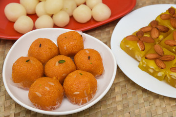 Burfi Delhi sweets for Diwali Indian mithai. Indian sweet food or diwali sweets Mithai Halwa, Milk Peda, Laddu or Ladoo, Rasgulla, Rasagulla for celebration in Delhi, India.