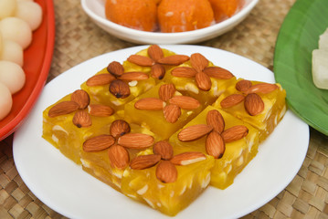 Burfi Delhi sweets for Diwali Indian mithai. Indian sweet food or diwali sweets Mithai Halwa, Milk Peda, Laddu or Ladoo, Rasgulla, Rasagulla for celebration in Delhi, India.