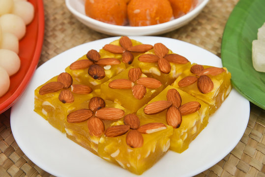 Burfi Delhi sweets for Diwali Indian mithai. Indian sweet food or diwali sweets Mithai Halwa, Milk Peda, Laddu or Ladoo, Rasgulla, Rasagulla for celebration in Delhi, India.