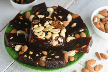 Indian sweet food Kozhikodan black Halwa made with dry fruits for celebration special occasion  Kerala India. Popular traditional festival dessert for Diwali, Ramadan, Eid, Dusshera