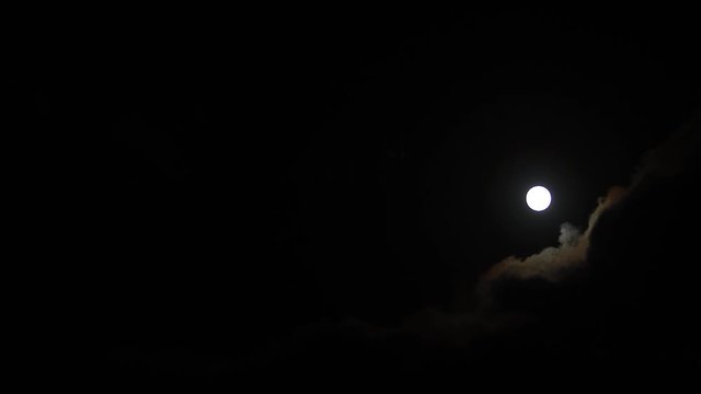 Clouds passing by moon at night. Full moon at night with cloud real time. mystery fairyland scene.