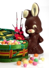 Chocolate Rabbit and Eggs for Easter against White Background