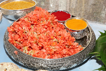 turmeric and kumkum powder in silver bowl for pooja