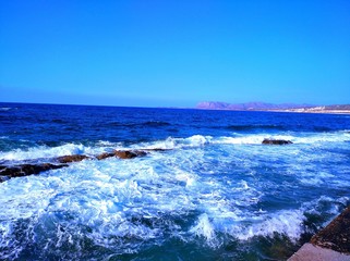  Beautifull small waves heating the small rocks at old port of Chania in Crete, Greece