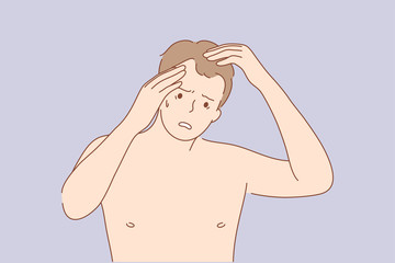 Health, care, frustration, examination, irritation concept. Young frustrated sad upset man guy with alopecia cartoon character looking at mirror examining head. Age problem of hair loss illustration.