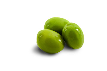 Three large green olives isolated on a white background. Close-up.